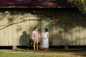 man-and-pregnant-woman-by-barn-door 